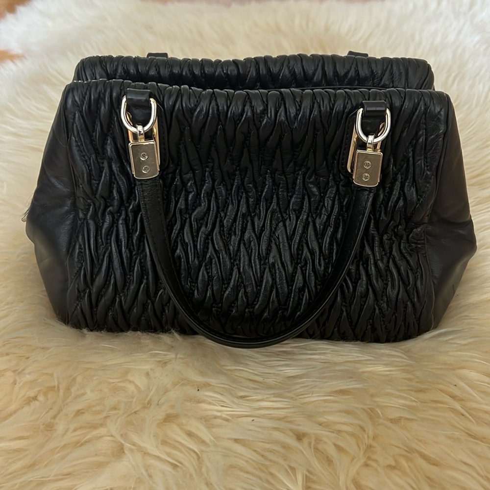 Black COACH Madison gathered twist mini satchel with crossbody strap.